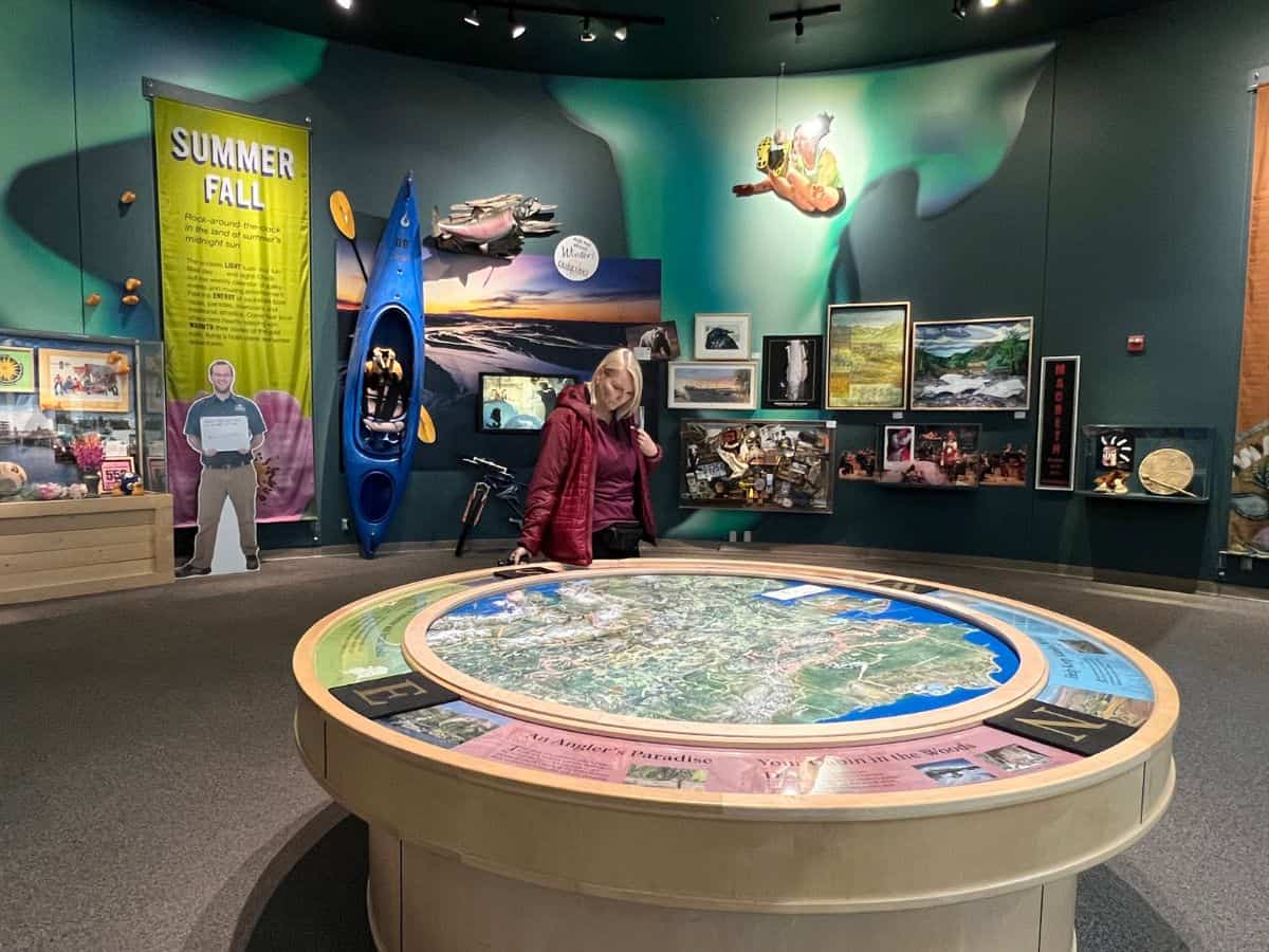 A woman looks at exhibits in the Morris Thompson Cultural and Visitors Center in Fairbanks, Alaska.