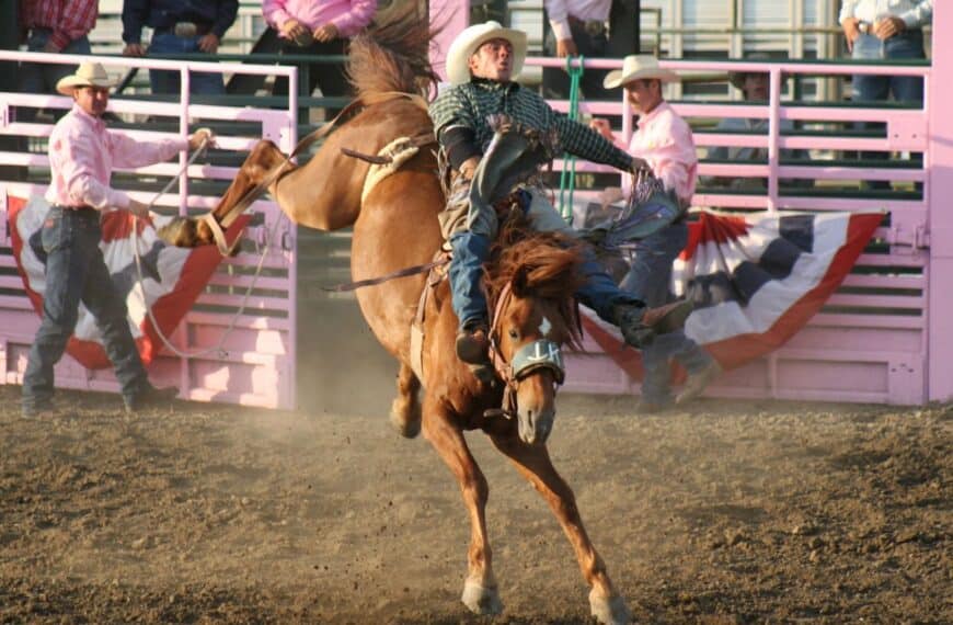 A man rides a horse at a rodeo in Mandan, ND.