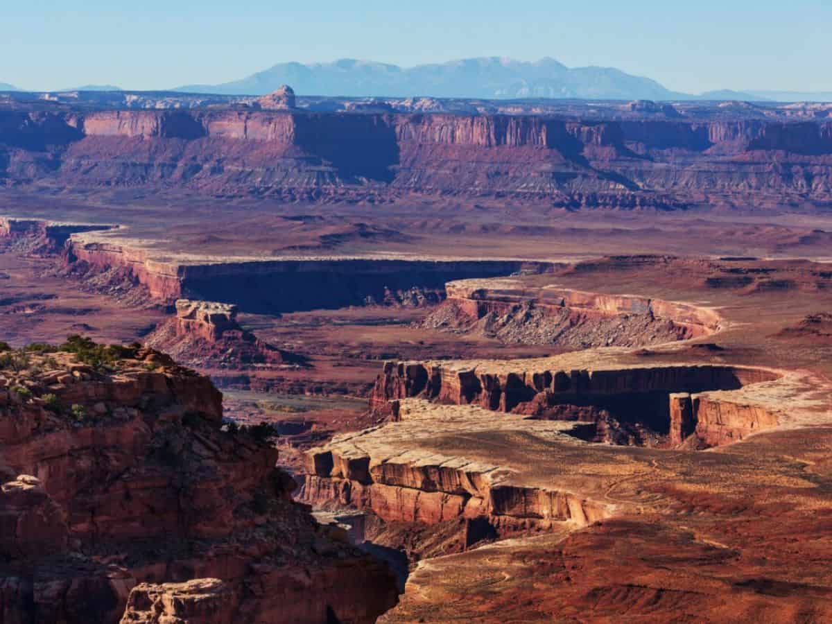 A river snakes through a massive canyon.