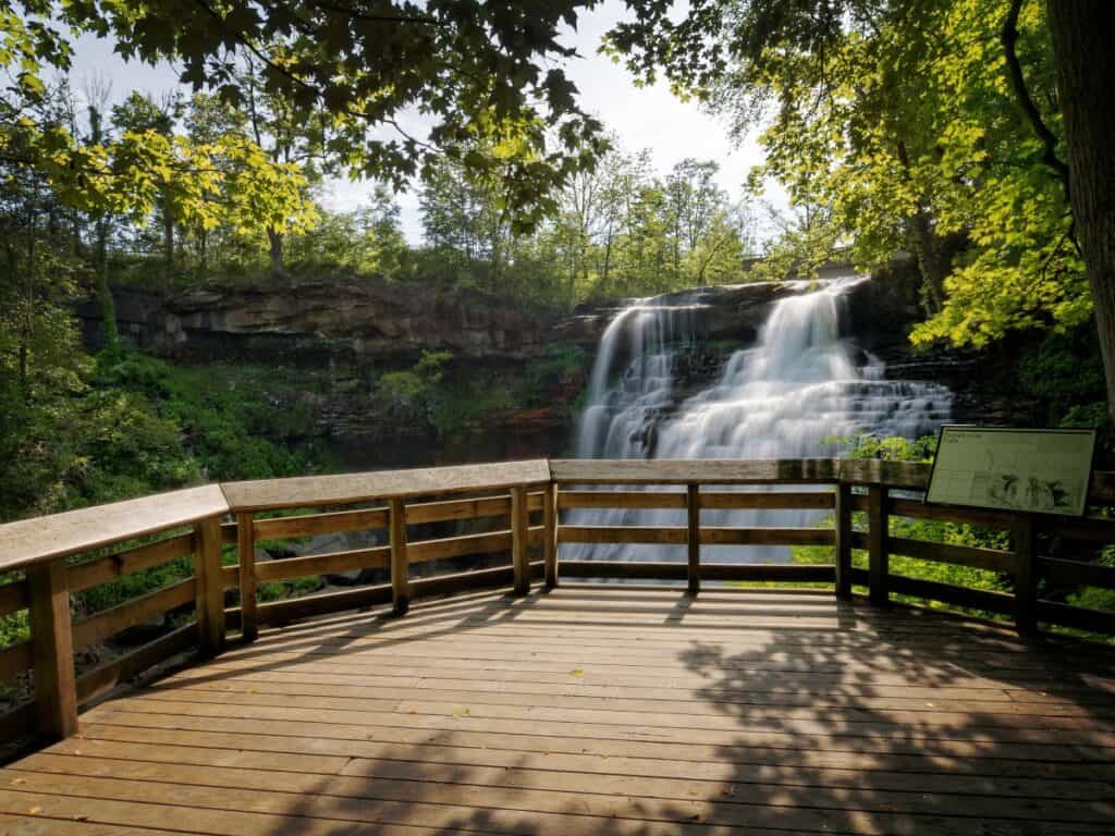 A viewing platform overlooks a waterfall