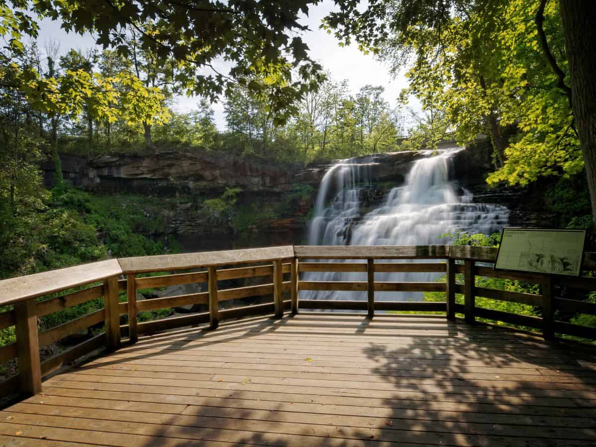 A viewing platform overlooks a waterfall
