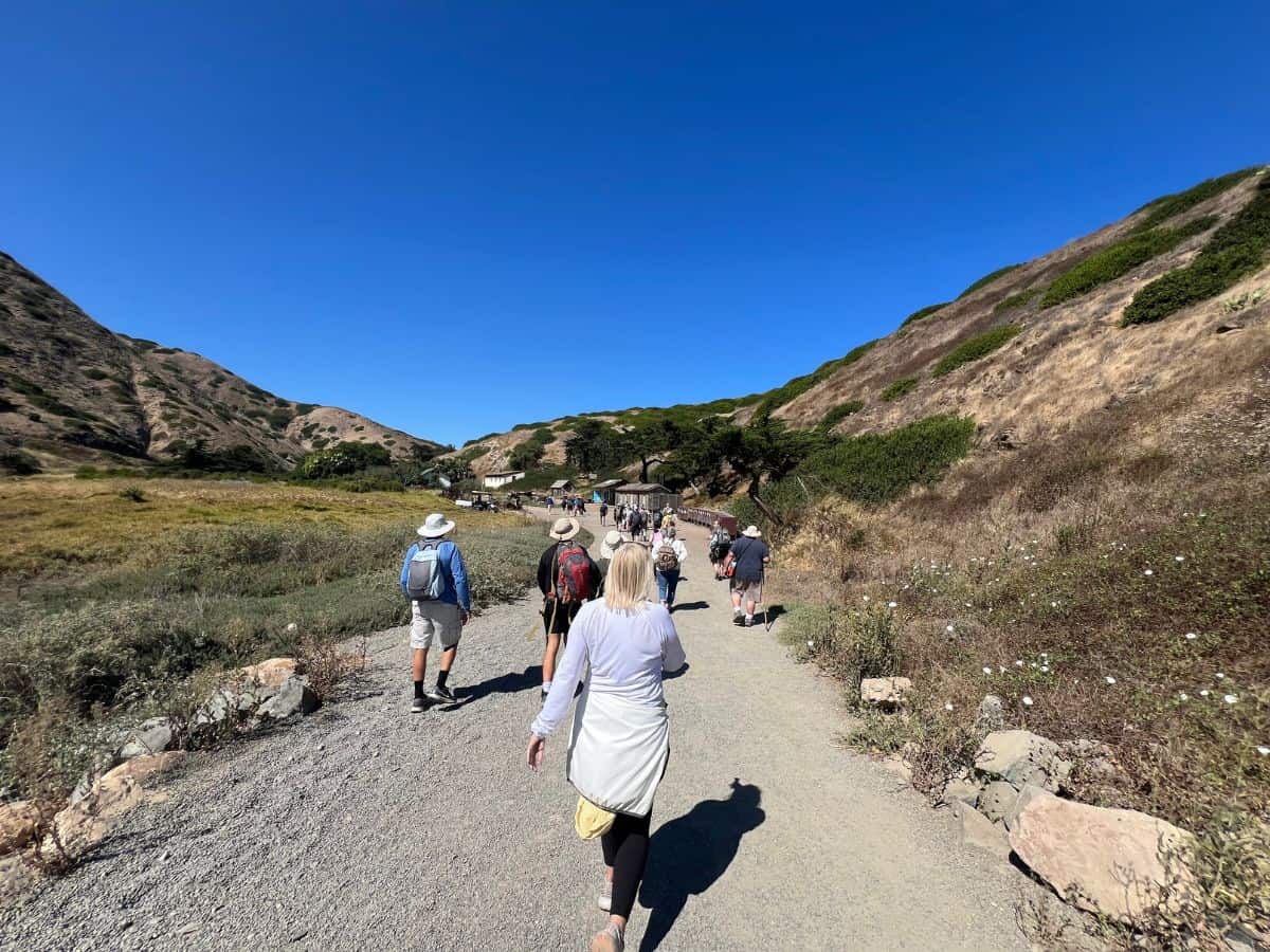Visitors walk along a path into Channel Islands National Park