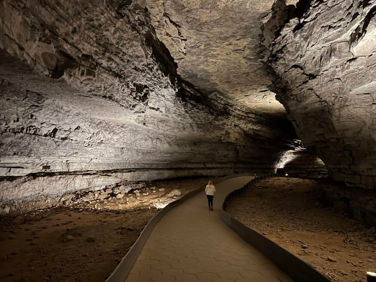 A woman walks along a trail in Mammoth Cave National Park, KY