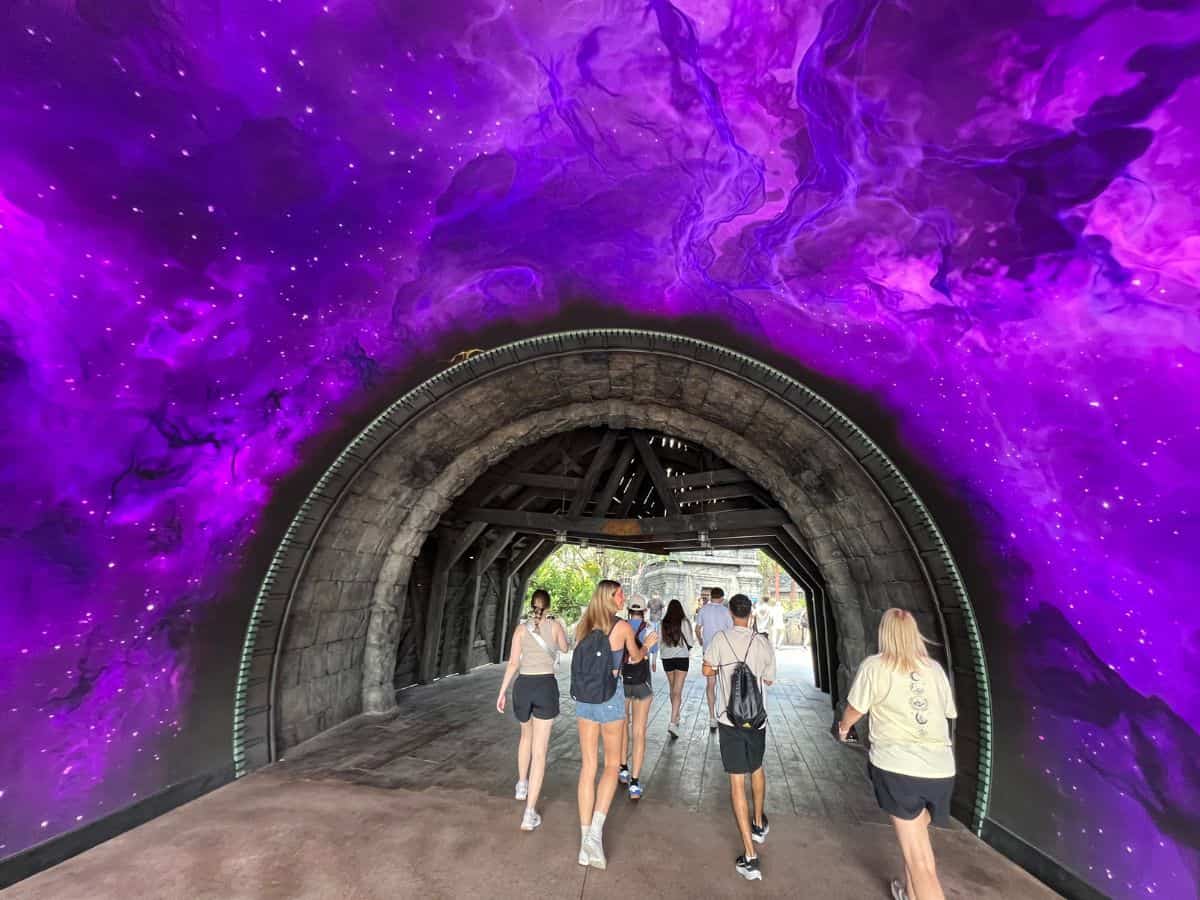 Visitors walk through the portal in Dark Universe at Epic Universe, Orlando, FL