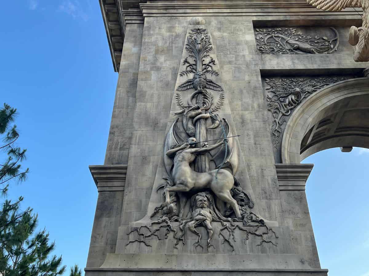 The Epic Universe Harry Potter world arch contains detailed features from Harry Potter and the Fantastic Beasts books and films.