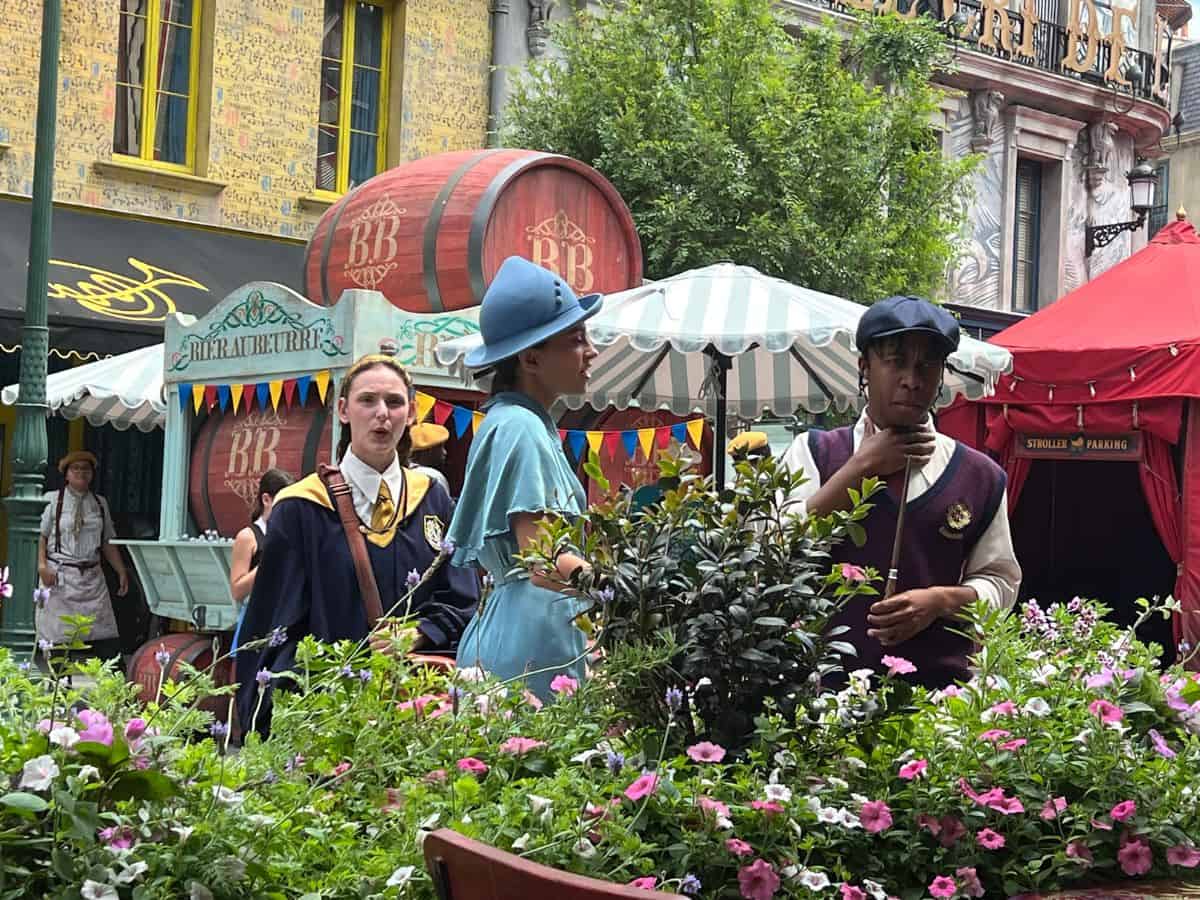 Students of magic roam Epic Universe and interact with guests