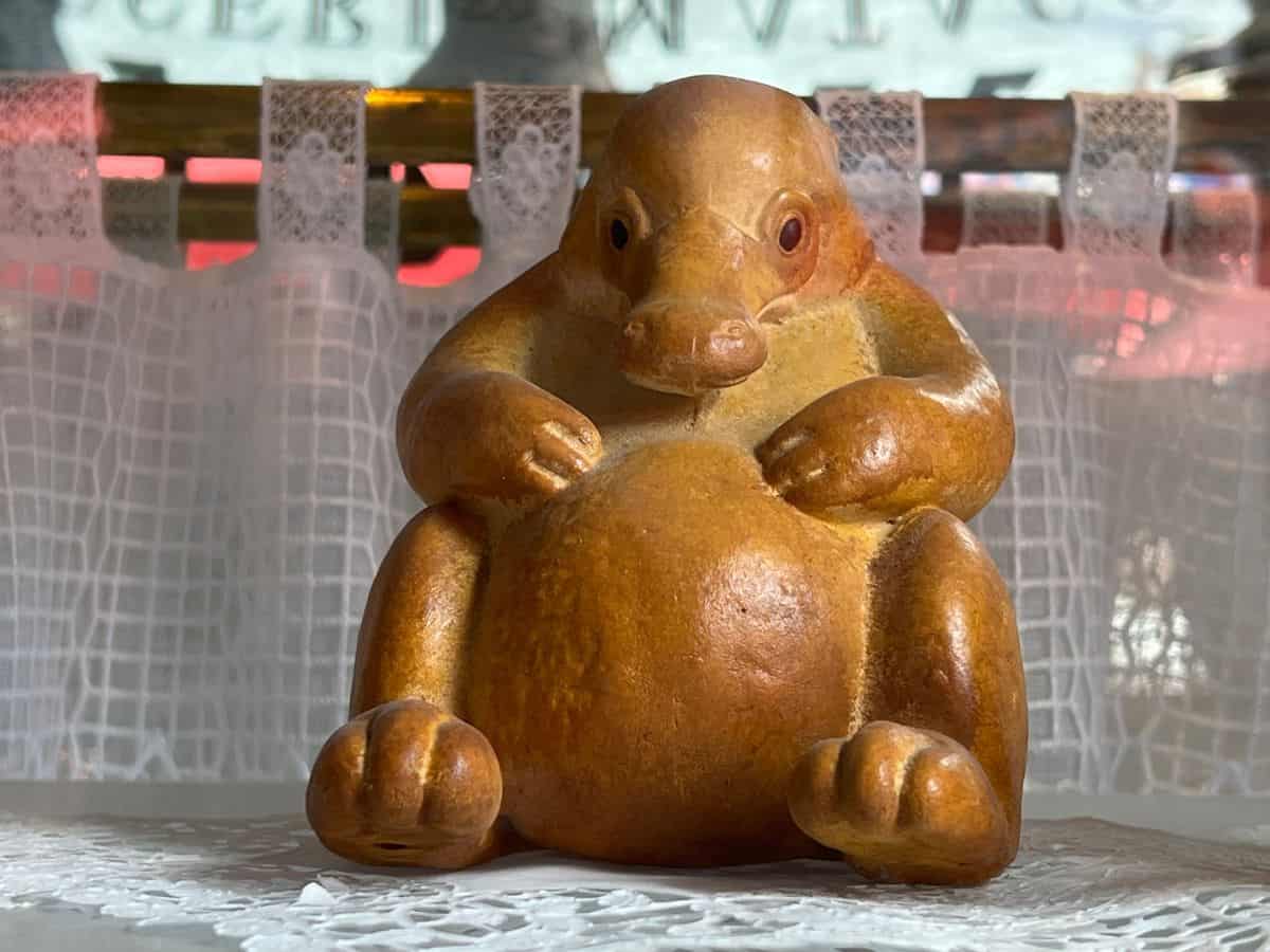 Niffler shaped bread sits in a store window in the Ministry of Magic, Epic Universe, Orlando.