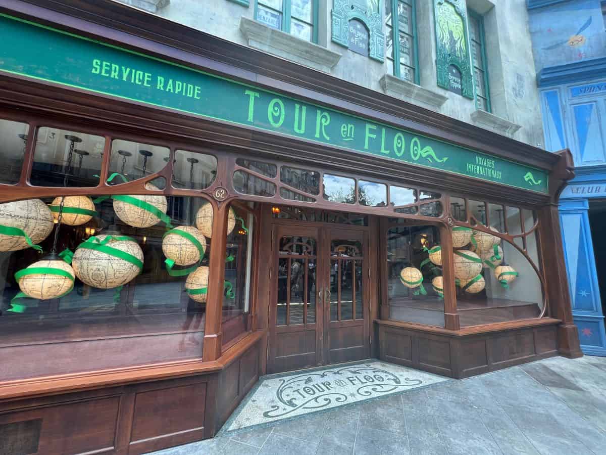 Floating globes appear in a store window.