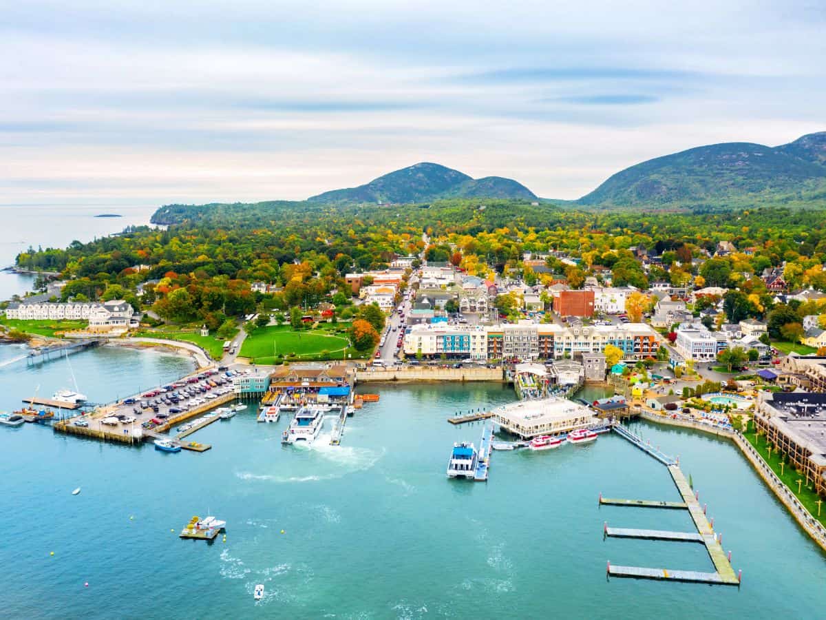 Blue waters and colorful buildings show on the horizon in Bar Harbor, Maine