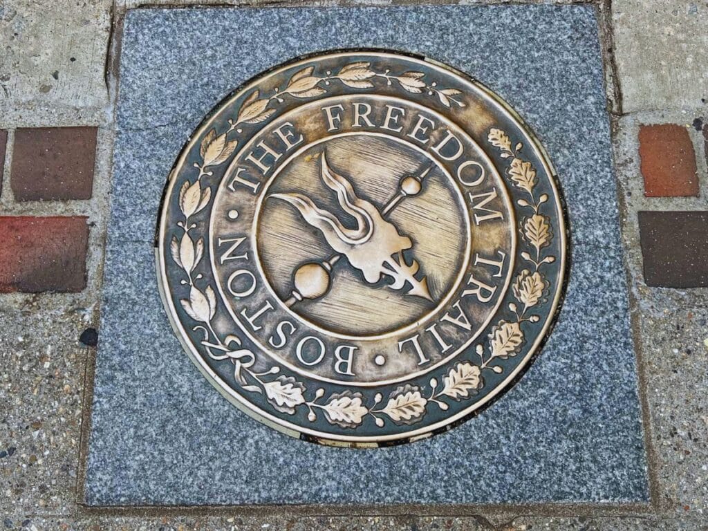 Two lines or red bricks and occasional markers lead people on the Boston Freedom Trail