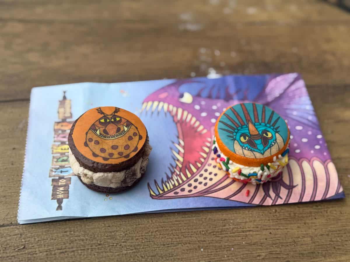 Dragon themed sandwich cookies sit on top of a bag with an image of a dragon
