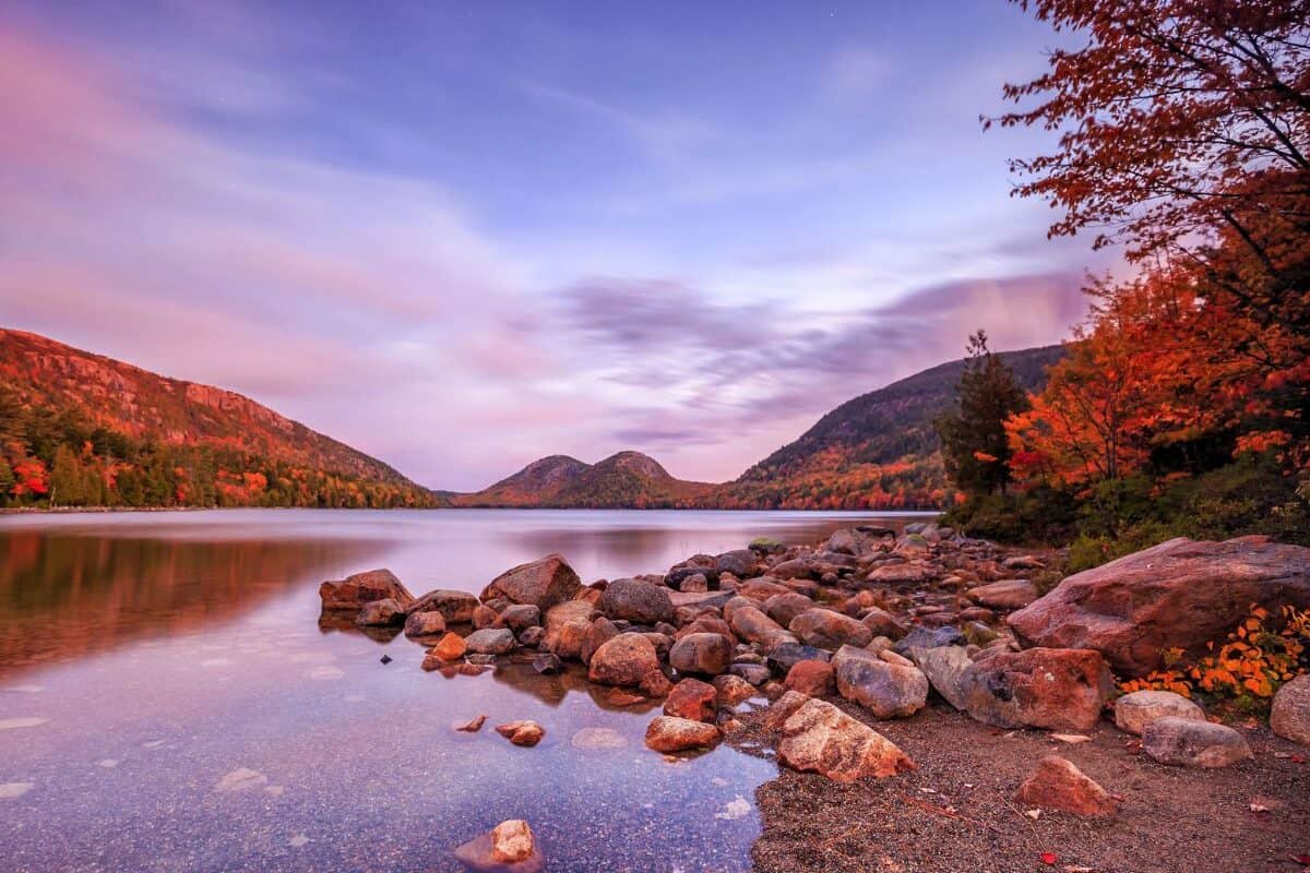 Autumn leaves adorn trees surrounding Jordan Pond, Acadia National Park, ME