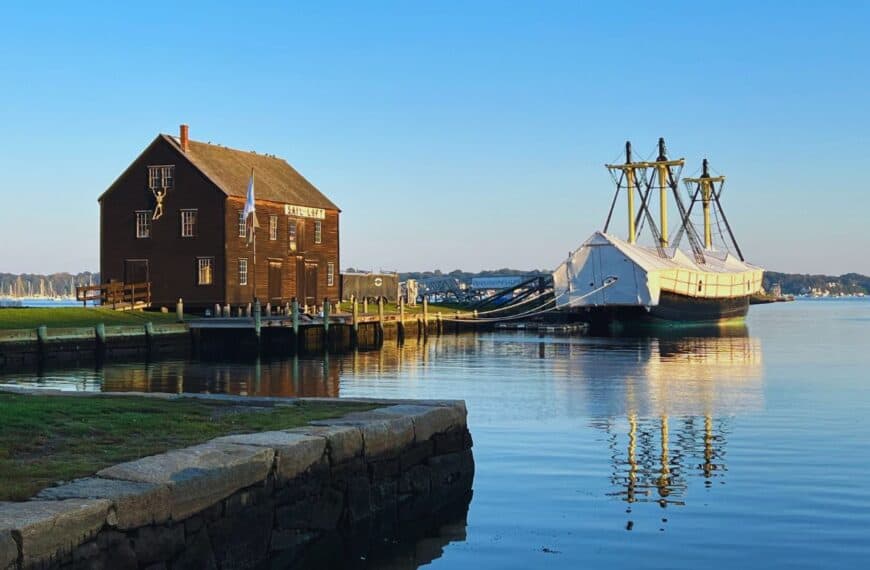 Calm waters in Derby Wharf show a reflection of the Friendship of Salem ship.