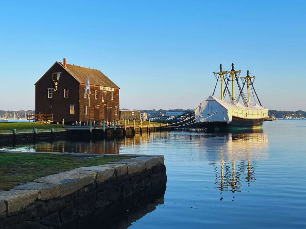 Calm waters in Derby Wharf show a reflection of the Friendship of Salem ship.