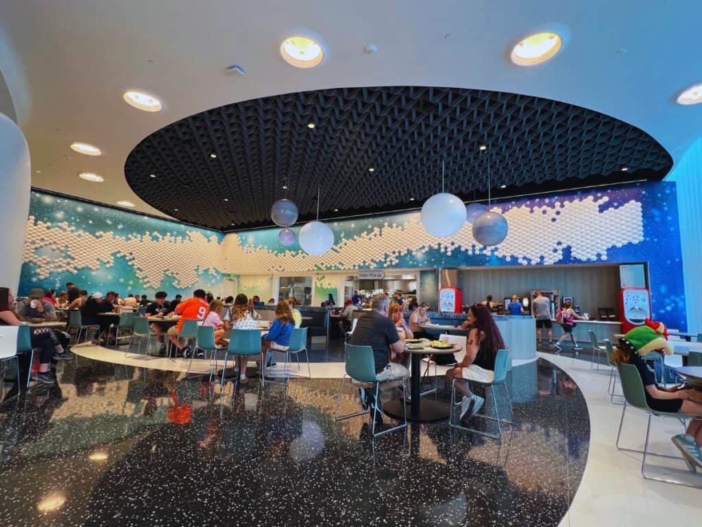 Guests dine in Cosmos Cafe at Universal Stella Nova Resort, Orlando, Florida