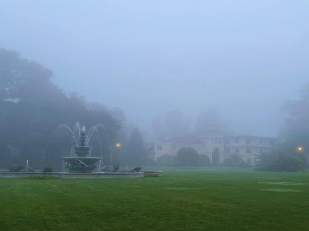 Morning fog lingers at the Wylie Inn and Conference Center grounds near Salem, MA