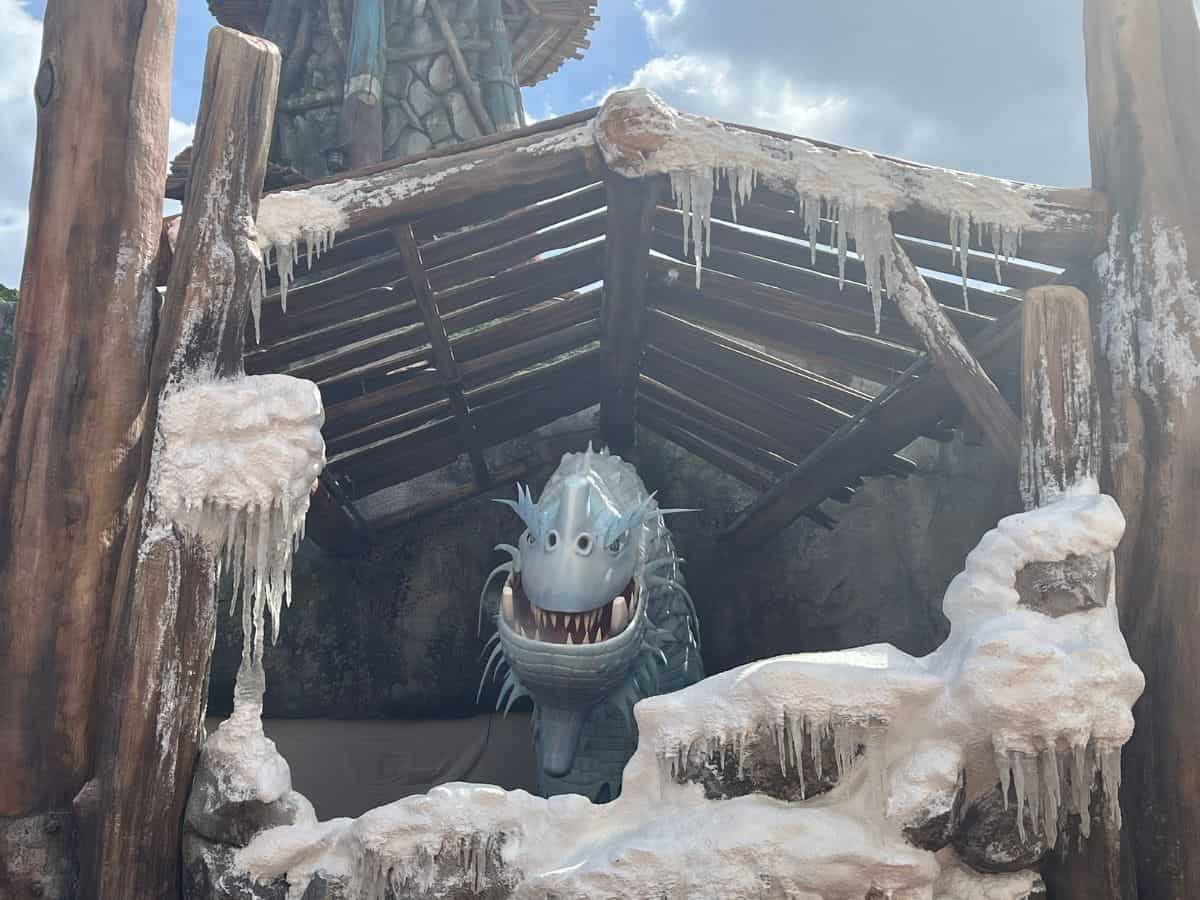 An ice dragon gives a menacing grin