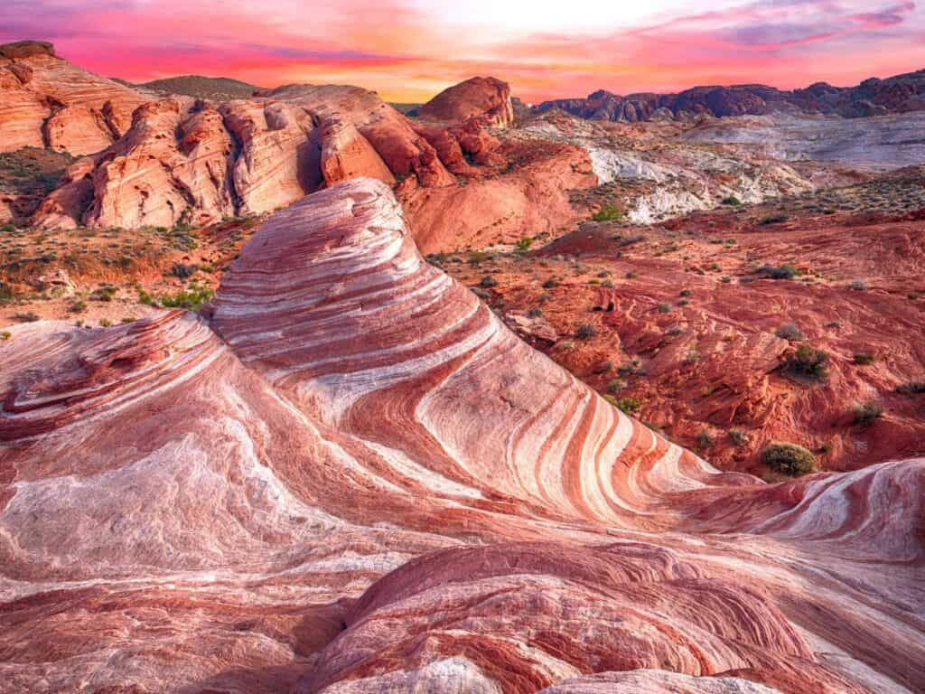 Rock formations display surreal red and white swirls in Valley of Fire State Park, NV
