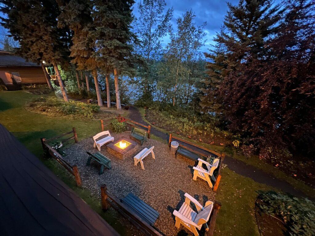 Empty chairs sit near a fire pit, awaiting guests at Pike's Waterfront Lodge, Fairbanks, Alaska