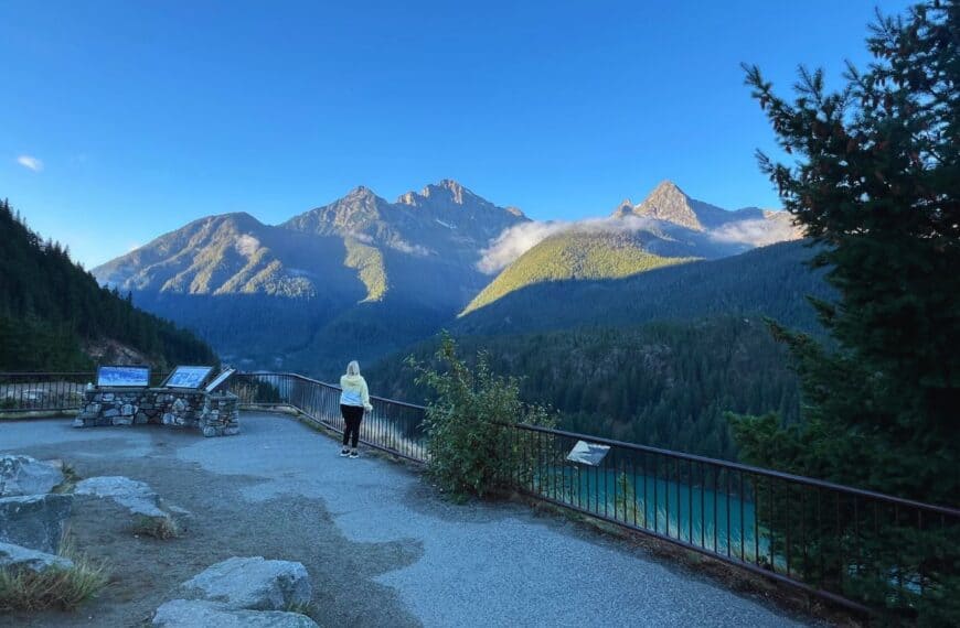 A woman gazes at Diablo Lake in North Cascades National Park from an overlook