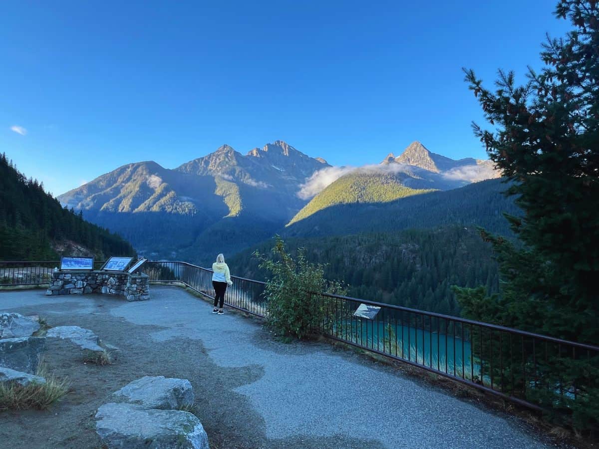 A woman gazes at Diablo Lake in North Cascades National Park from an overlook
