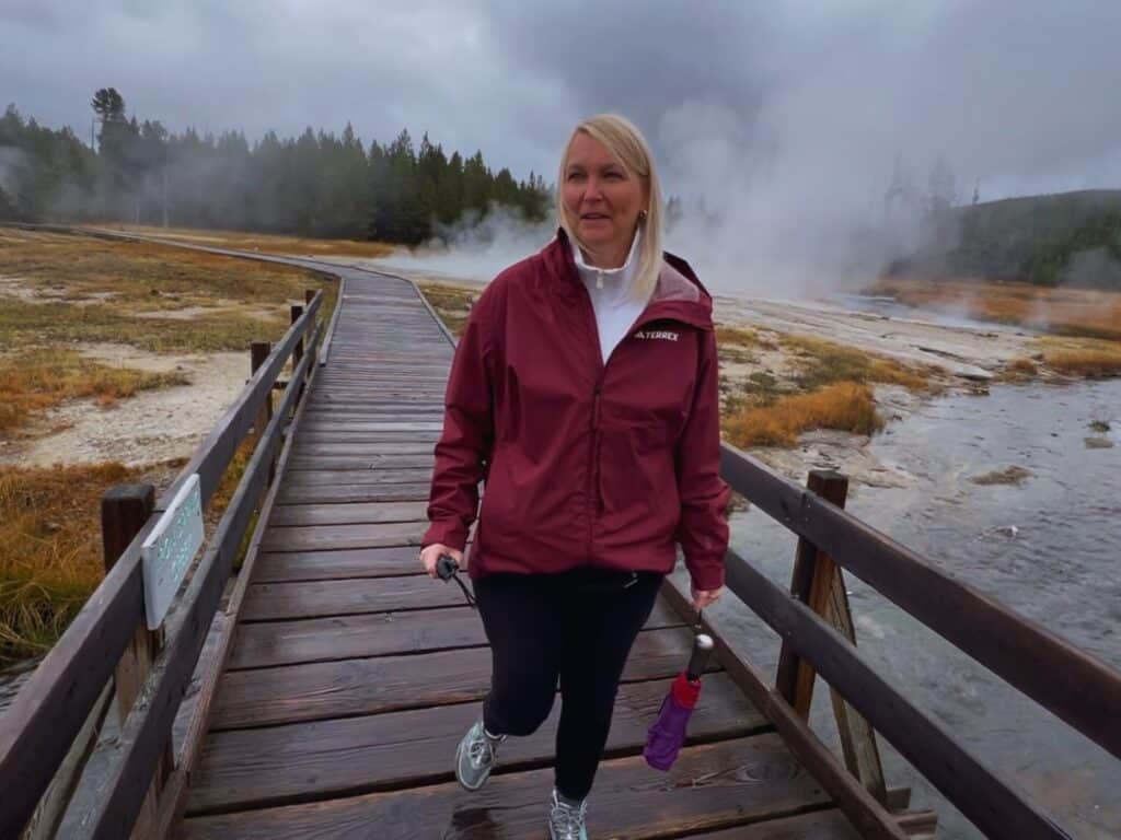 A woman makes a face due to the smell of sulfur in Yellowstone National Park, Wyoming