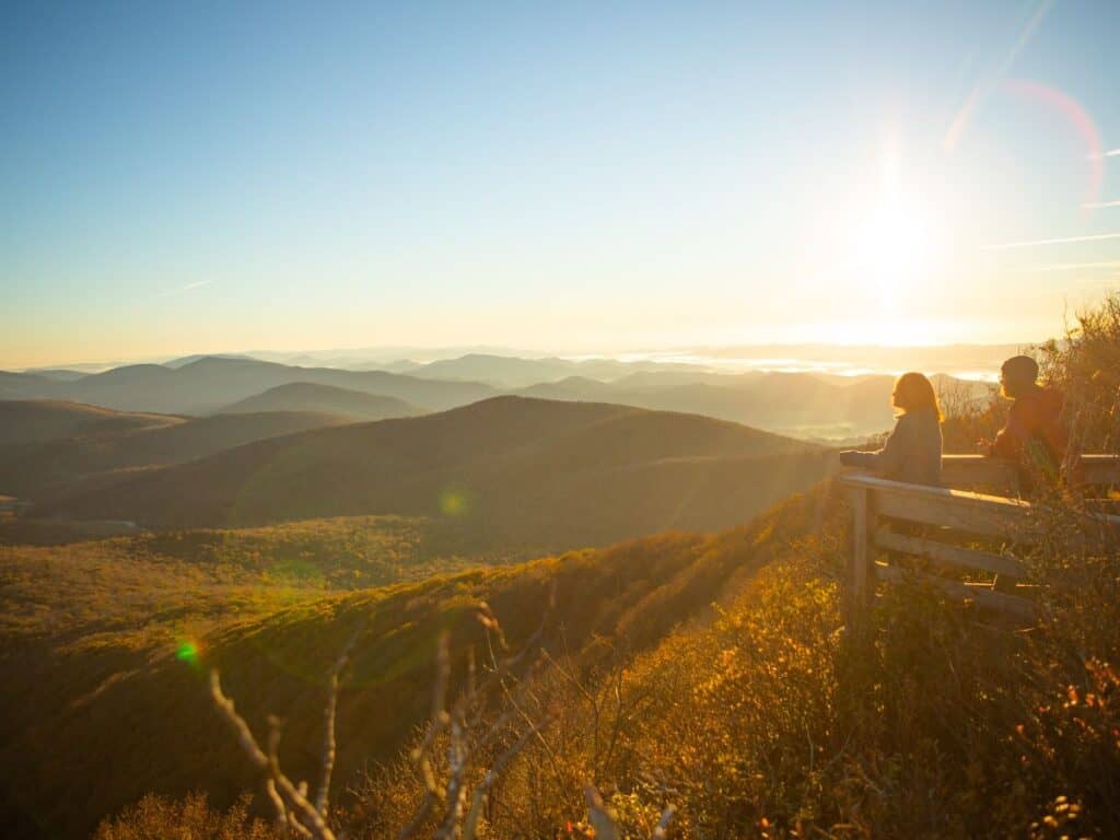 A couple savors the open views at Elk Knob State Park, NC.
