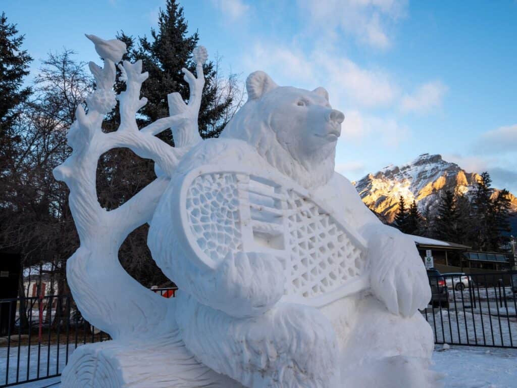Closeup of a giant bear snow sculpture at the SnowDays Festival in Banff and Lake Louise, Alberta, Canada.