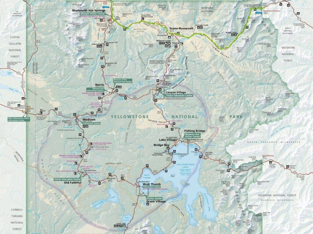 A green dashed line on a map represents Yellowstone National Park's only road open in winter.