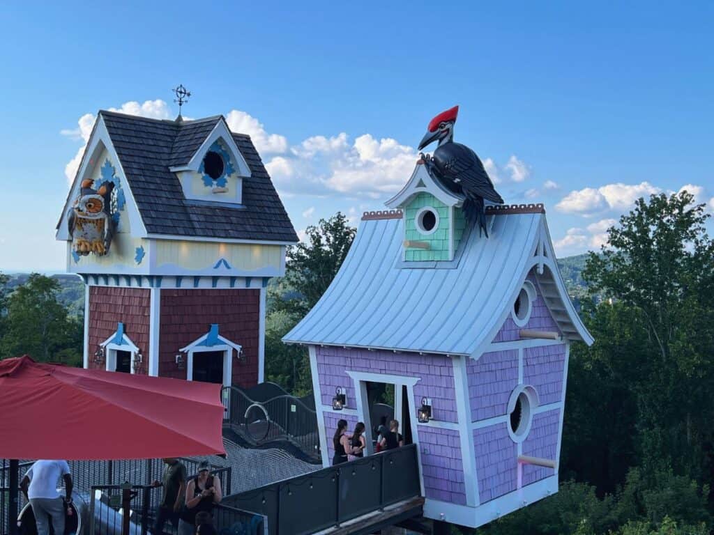 Anakeesta visitors walk through giant birdhouses.